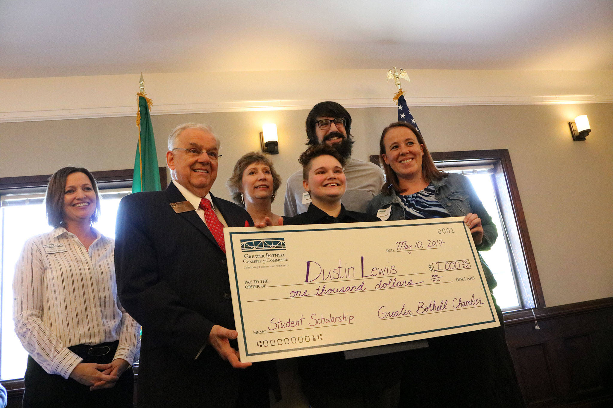 Secondary Academy for Success (SAS) student Dustin Lewis (center) is the recipient of this year’s Greater Bothell Chamber of Commerce scholarship. He poses with the big check alongside chamber representatives and SAS staff. SAMANTHA PAK, Bothell Reporter
