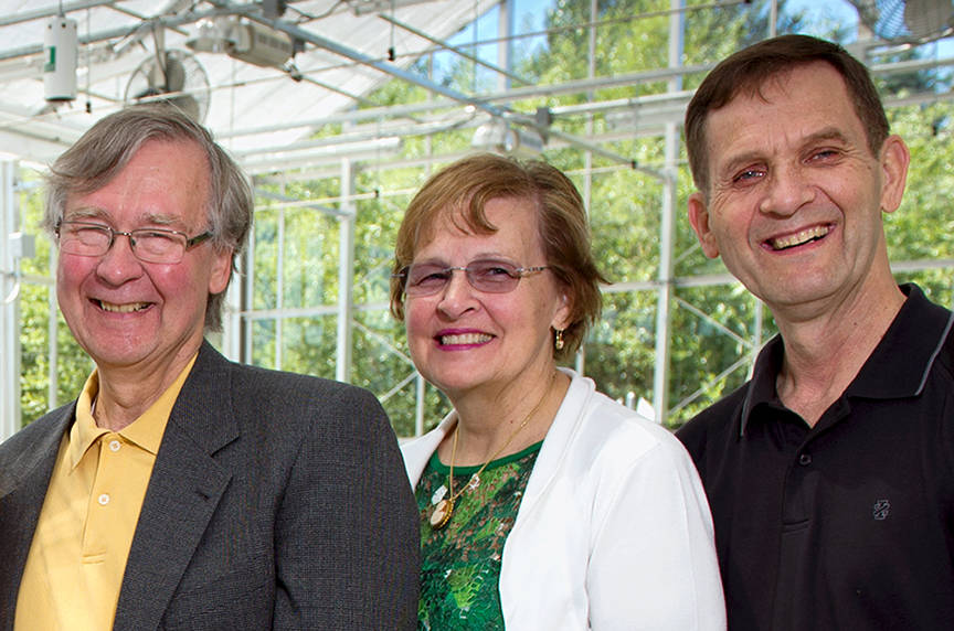 Ronald Green Jr. (left), Janet Green Hunter and Darrell Green pose for a photo in the Sarah Simonds Green Conservatory greenhouse. Contributed photo