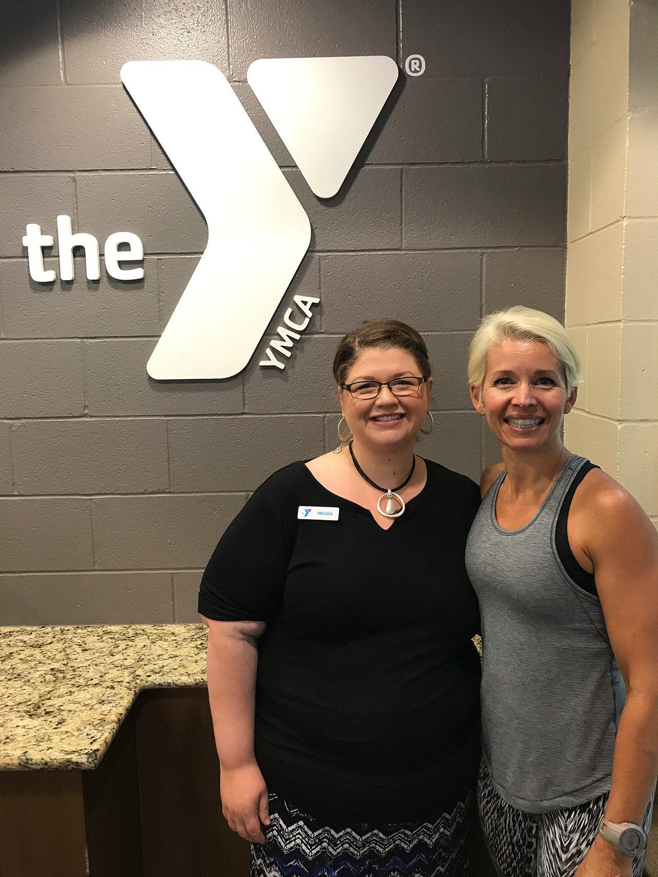 From left to right: Melissa Osterloo, Y member engagement director, and Jodi Milner, a Y fitness instructor, performed CPR and used an AED on a man in cardiac arrest, saving his life Monday. Photo courtesy of the Northshore YMCA