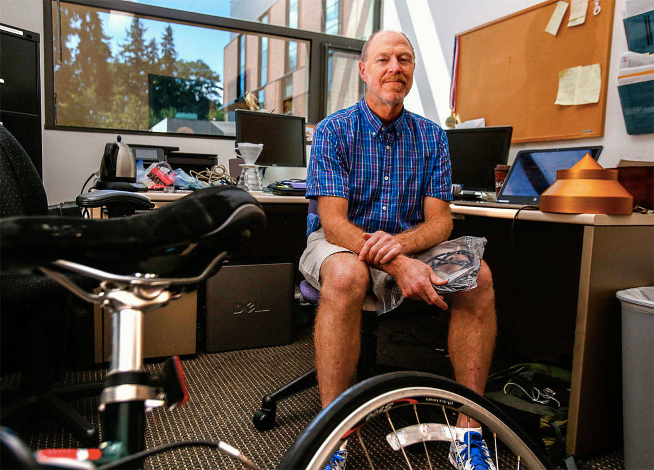 University of Washington at Bothell science professor Dan Jaffe, seen here in his office, is a featured speaker in the UW-Bothell pub series held at McMenamins Anderson School in Bothell. (Dan Bates / The Herald)