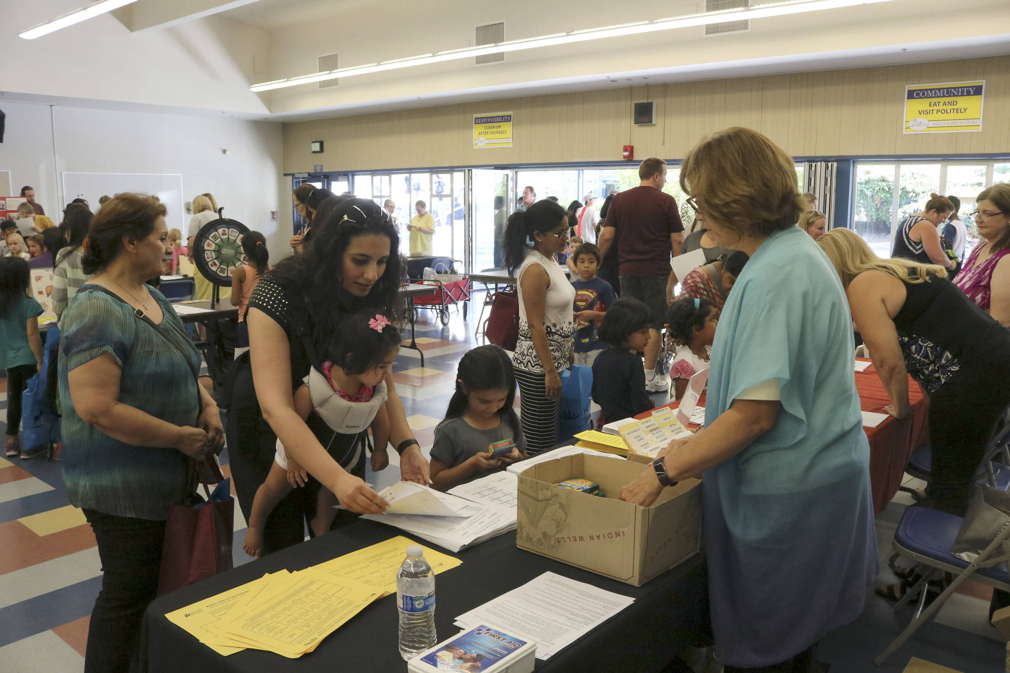 Pooyeh Arvan collects information on school start times at the Northshore School District Back to School Fair Aug. 16. Megan Campbell, Bothell/Kenmore Reporter