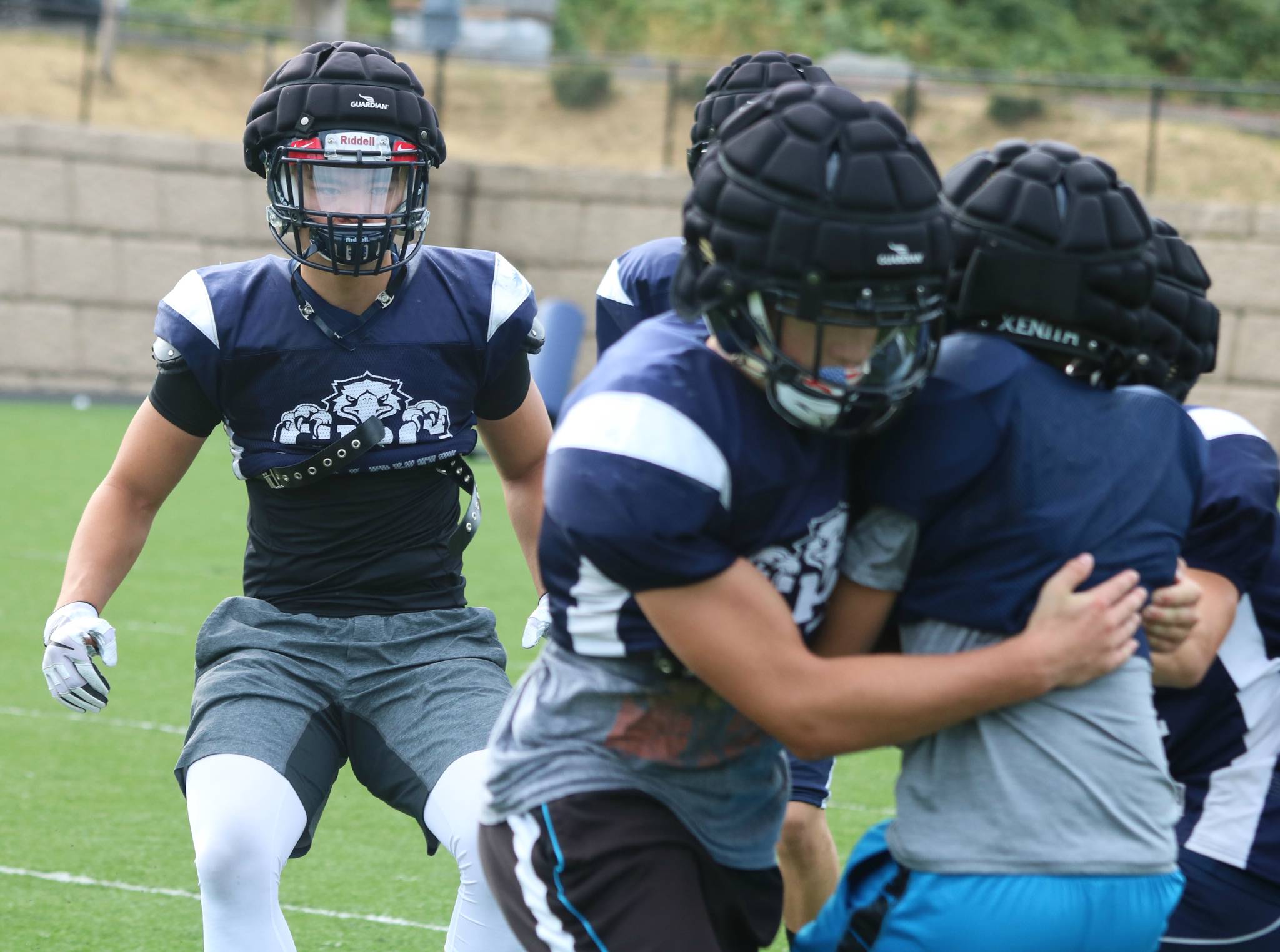 Senior returner Jason He, left, gets in on the action during a recent practice. Andy Nystrom/Bothell-Kenmore Reporter