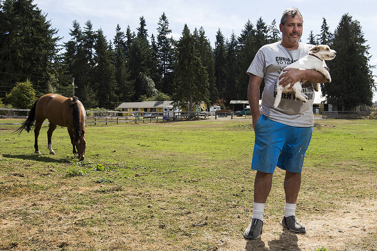 Leo Gese stands in a pasture at his home on 174th Street Southeast in Bothell. Leo and Marla Gese have lived on their property for 15 years. The Everett school board voted to use its condemnation powers for the first time in a quarter century to acquire four pieces of land in the Bothell area for a future high school.The Geses are not against selling, but the school district has based its offers on rural property values, some two to three times less than what developers have offered for 3.8 acres. Andy Bronson, The Herald