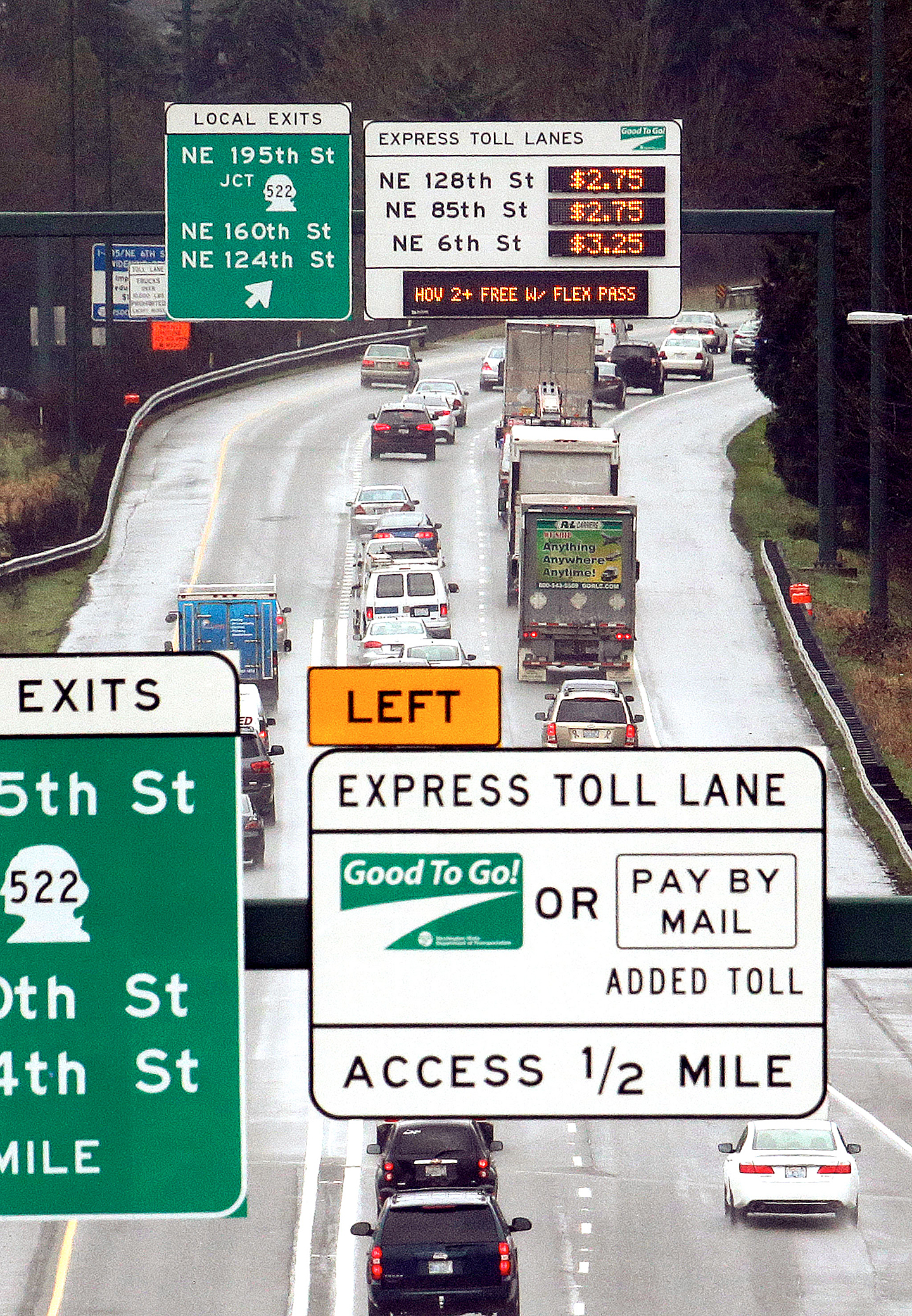 Signs show the rates for using the express toll lanes for traffic headed southbound on Interstate 405, Tuesday, Feb. 16, 2016, in Bothell, Wash. Gov. (AP Photo/Elaine Thompson)