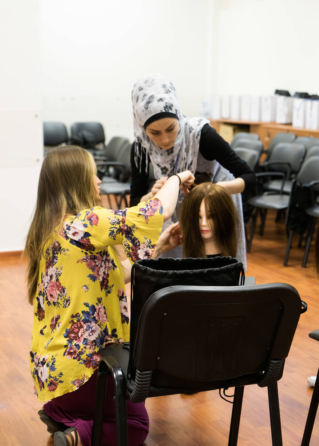 Jessica Dahl of The Beyond Project instructs a student in Lebanon on how to cut hair. Courtesy of Rachel Hile