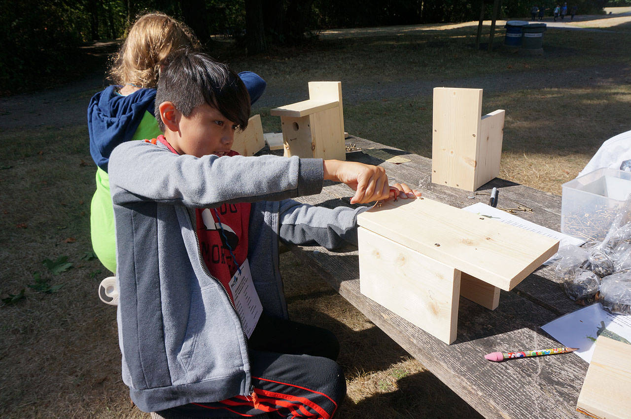 Ayateway Newman builds a bird house during Outdoor Education Day on Sept. 22. Courtesy of PACE at Woodmoor