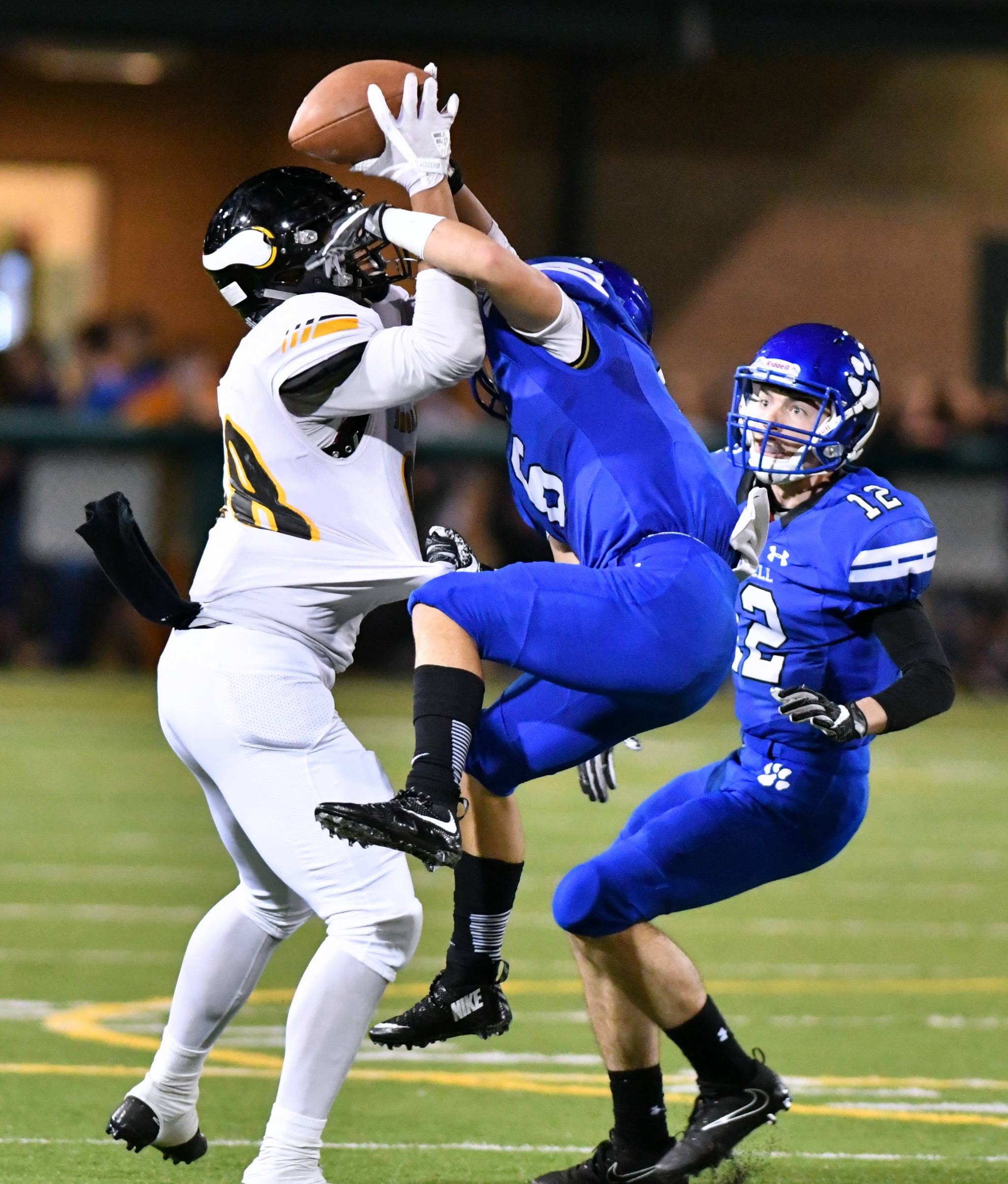 Inglemoor’s Quentin Moore, left, battles for the ball with Bothell’s Riley Morrison. Also pictured is Bothell’s Mason Locknane. Greg Nelson photo