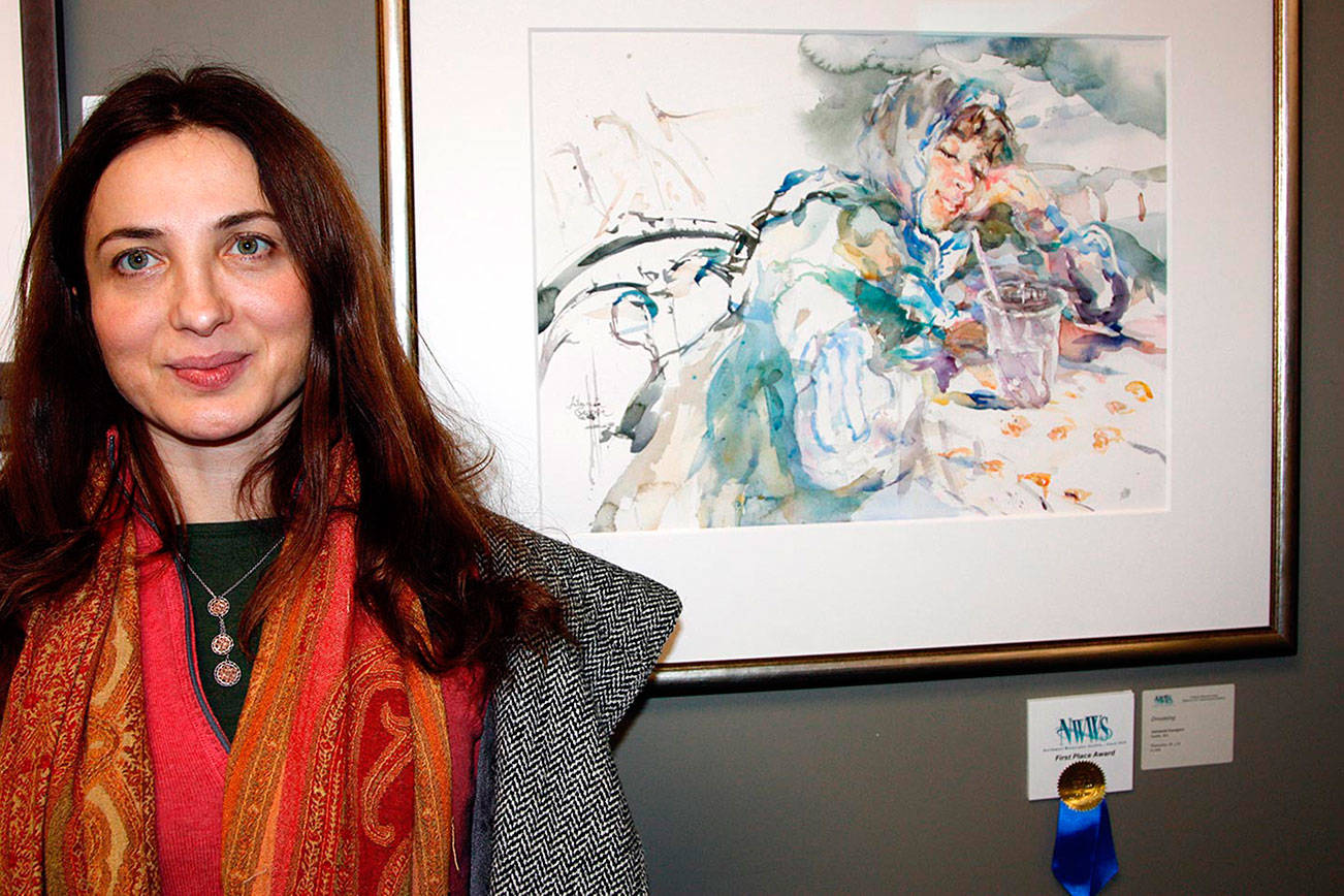 Antoaneta Georgieva poses with her first-prize painting, “Dreaming”. Courtesy of the Northwest Watercolor Society.