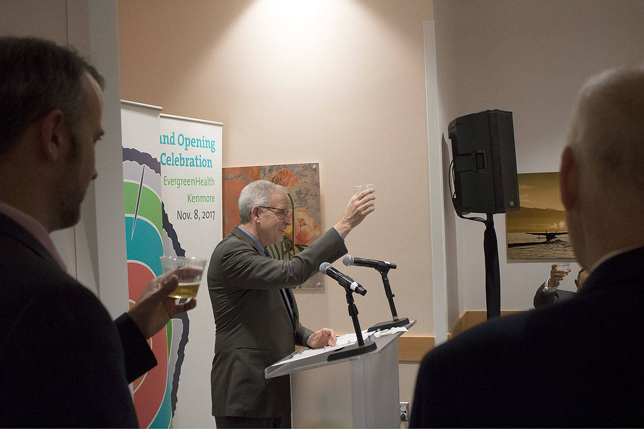 EvergreenHealth CEO, Bob Malte, gives a toast just before the ribbon tying ceremony at the grand opening celebration for Kenmore’s EvergreenHealth primary and urgent care clinic.