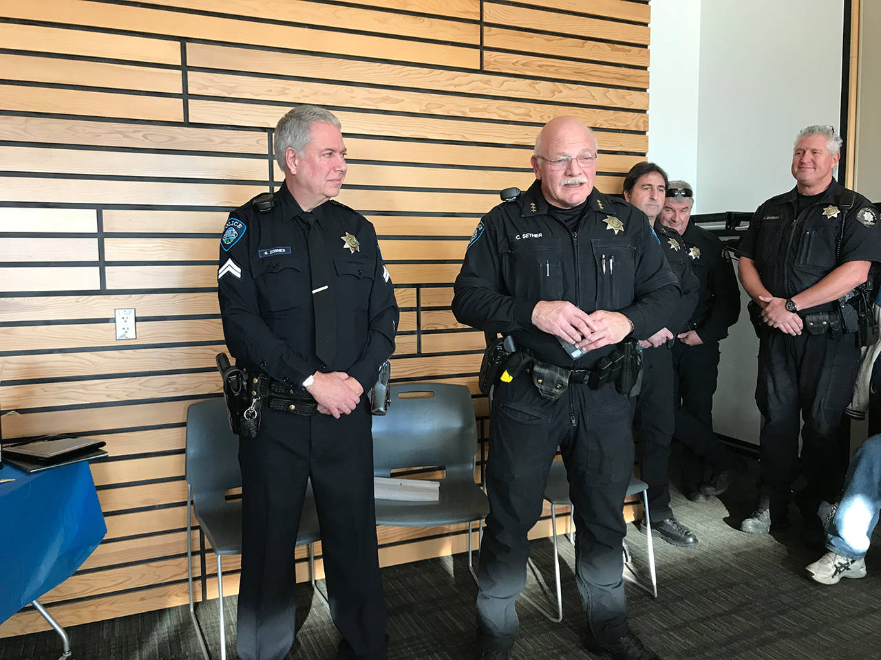 Kenmore Police Chief Cliff Sether (right) discusses deputy Gary Zornes’ long career serving the same community. Samantha Pak, Bothell/Kenmore Reporter