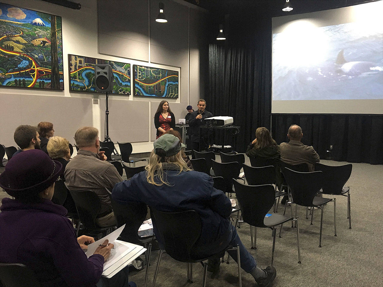 Kathleen Pozarycki and Florian Graner speak at an “Our Coast” film series event. Photo courtesy of Snohomish County Marine Resources Committee