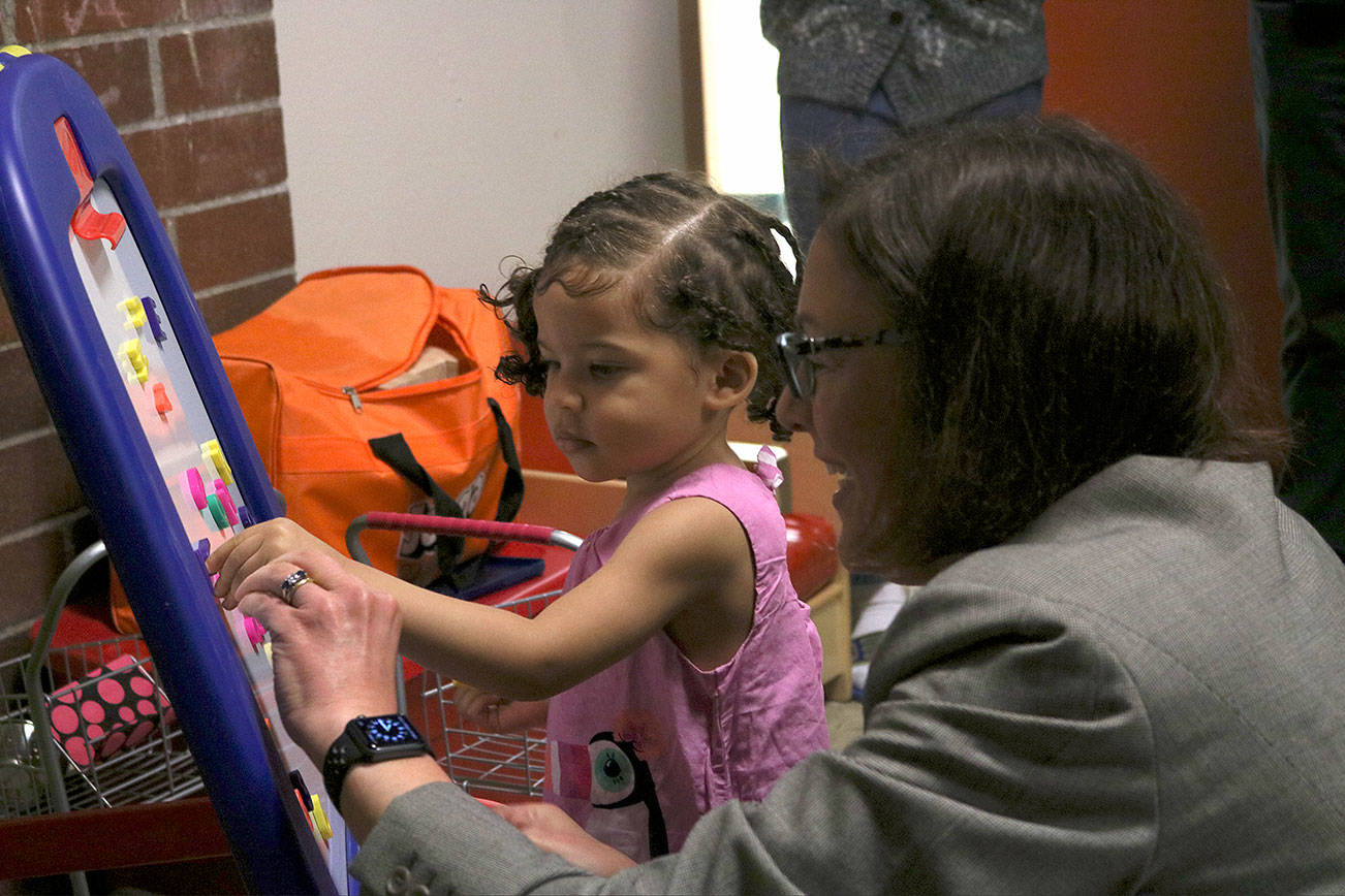 Kailan Manandic / Bothell-Kenmore Reporter                                Rep. Suzan DelBene meets and plays with one of the children living at Mary’s Place Northshore.