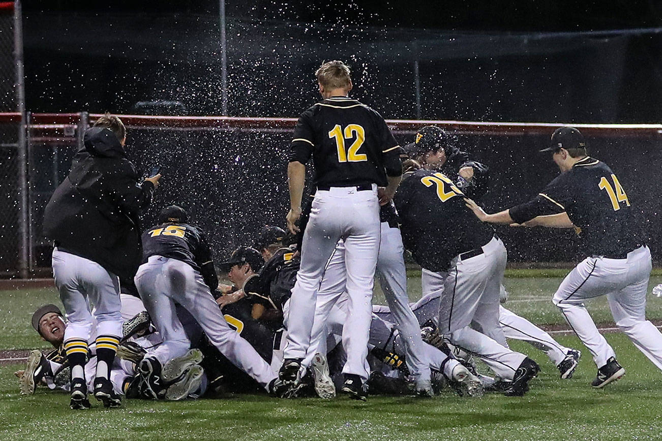 Photo courtesy of Rick Edelman/Rick Edelman Photography                                The Inglemoor Vikings celebrate after defeating the Skyline Spartans 7-3 in the Class 4A KingCo championship game on May 9 at Bannerwood Park in Bellevue. The Vikings clinched a berth in the Class 4A state tournament.
