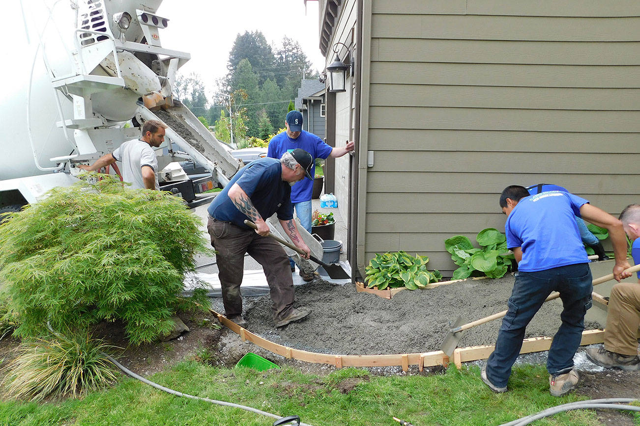 Volunteers build access ramps for locals