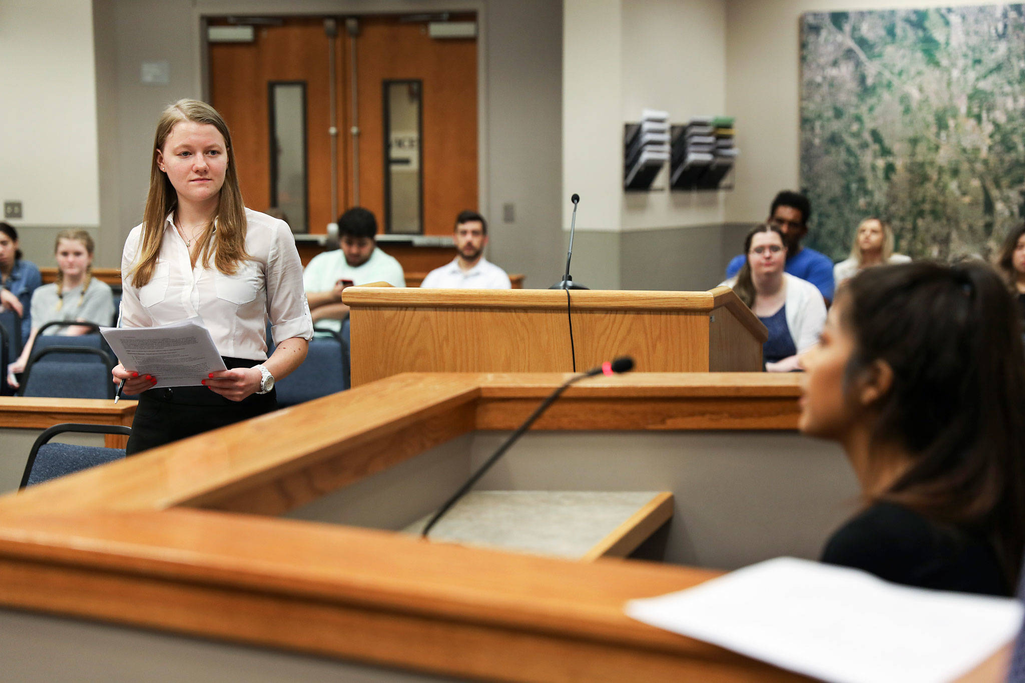 Julia Kozak questions a fellow high school student during a hearing in Bothell Youth Court. (Lizz Giordano / The Herald)