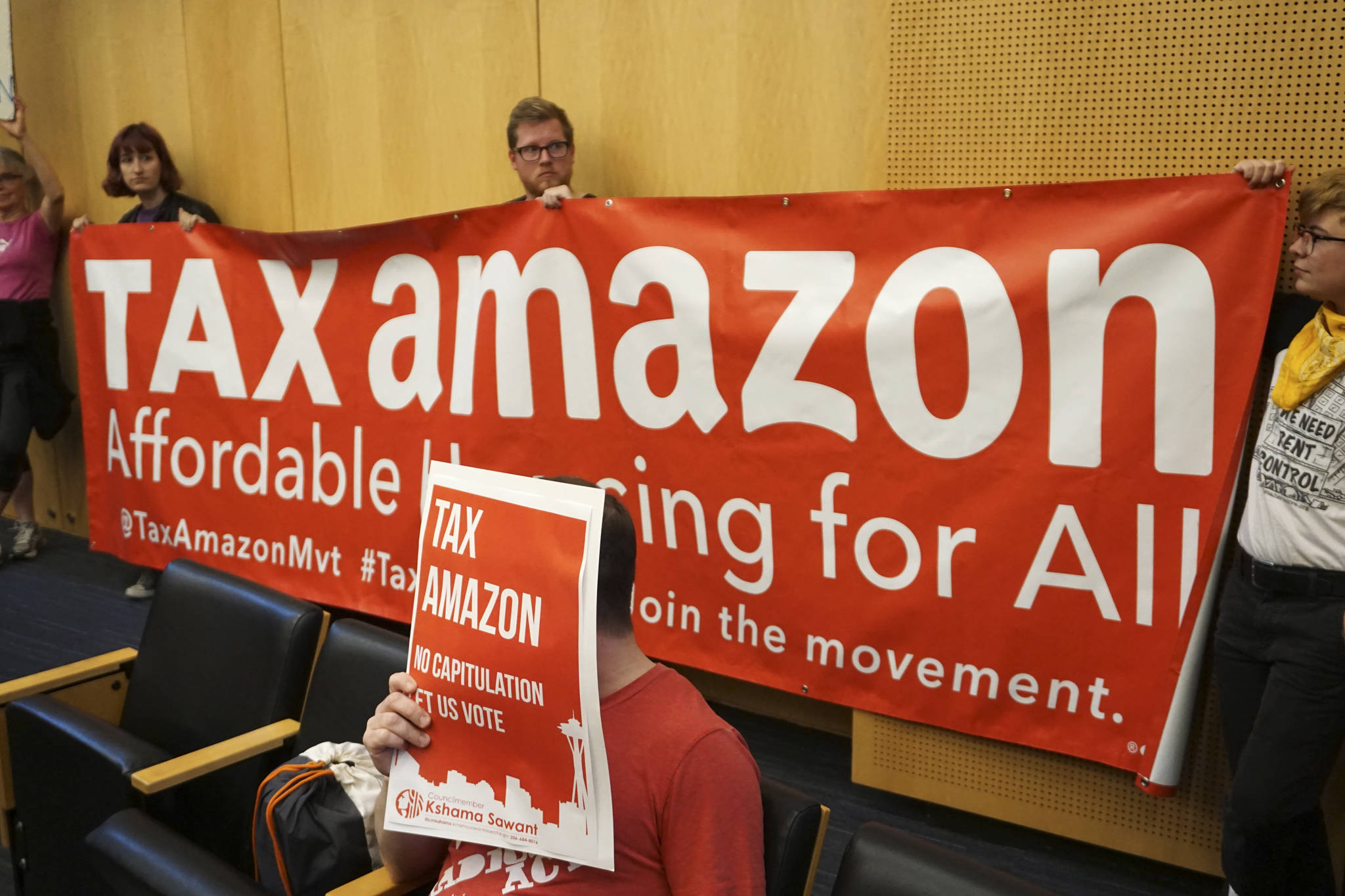 The public files into the City Council Chambers to voice their opinions prior to the vote to repeal the head tax. Photo by Melissa Hellmann