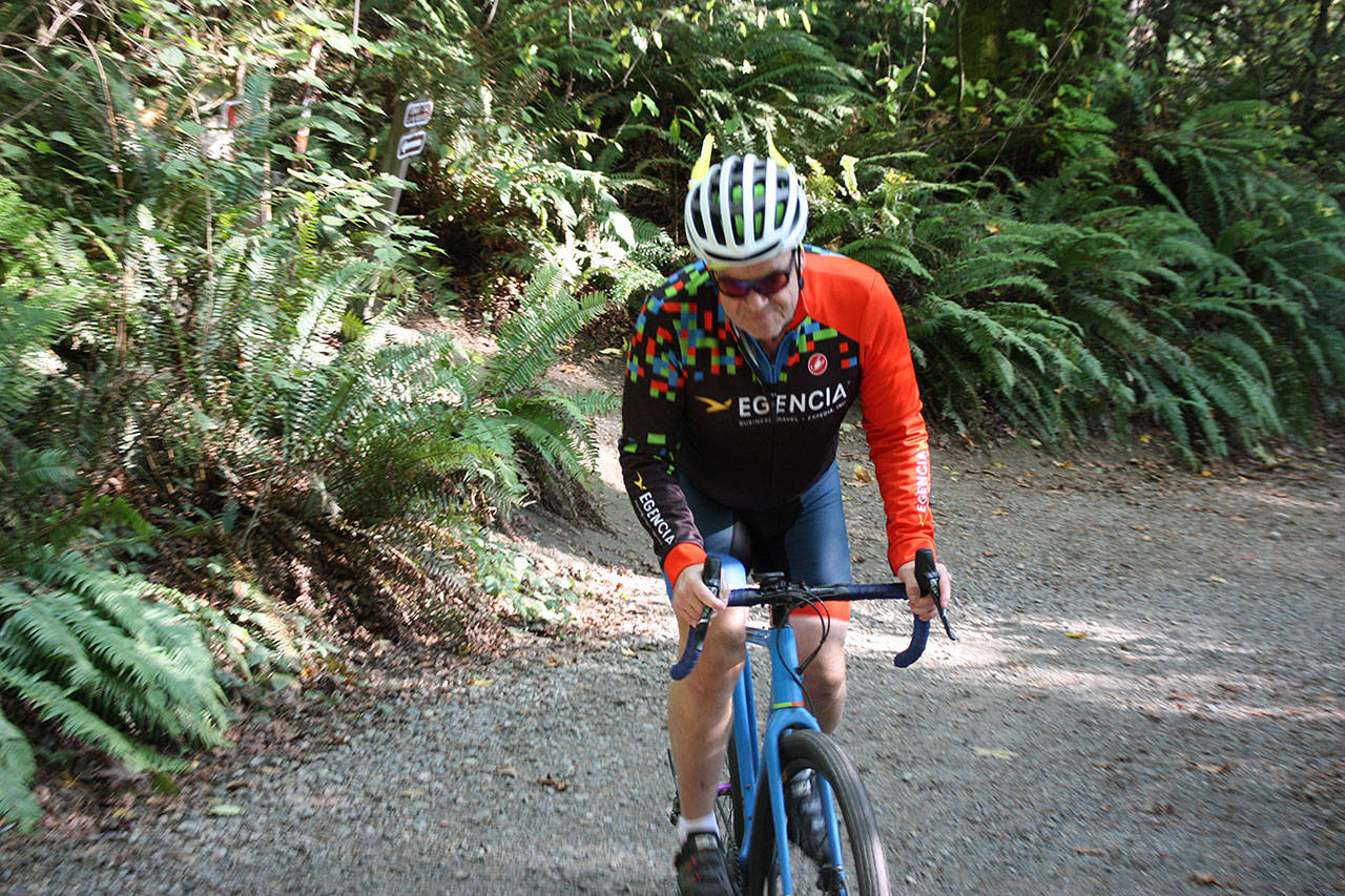 Bryan Willman rides his bike at the trails at St. Edward State Park. Aaron Kunkler/staff photo