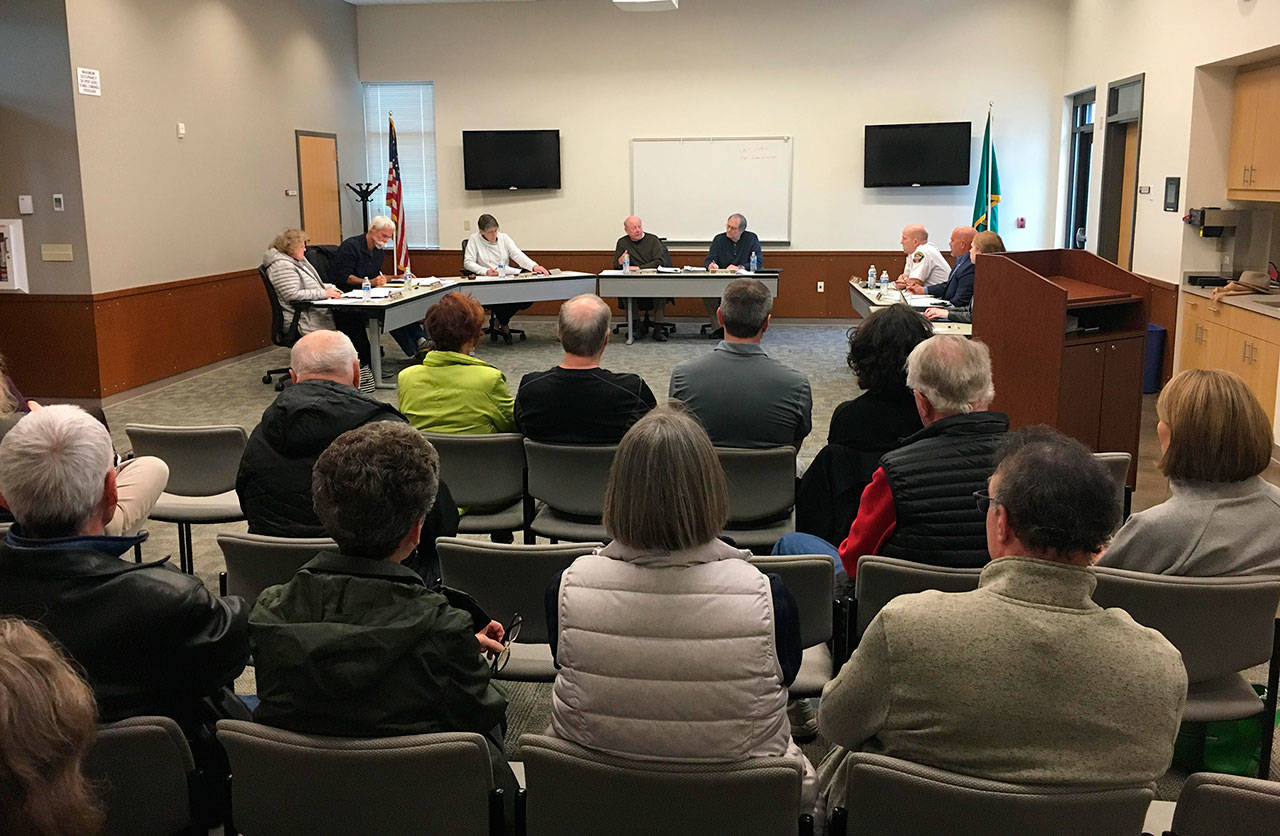 The Northshore Fire Department’s Board of Commissioners discusses its compensation policy at its April 3 meeting in Kenmore. Katie Metzger/staff photo