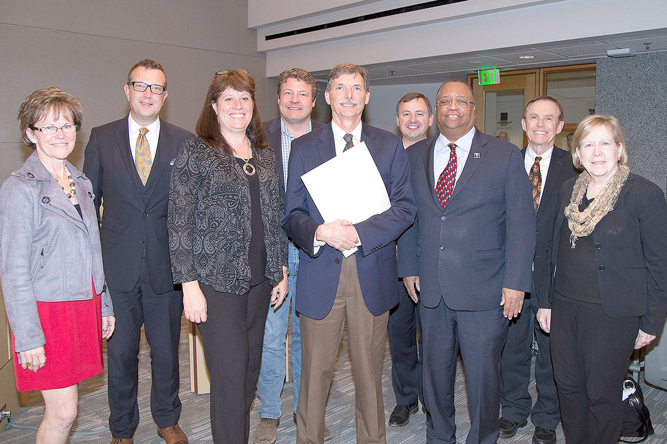 Members of the King County Council join retiring executive director of ARCH Arthur Sullivan after the council recognized Sullivan as a voice for affordable housing in East King County. Photo courtesy of King County.