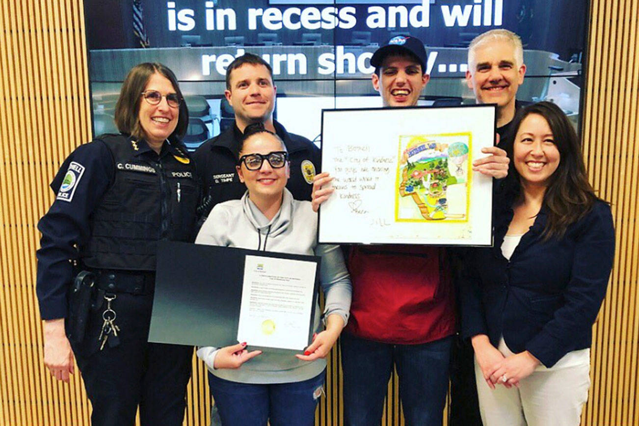 Members of the Bothell Police Department and Deputy Mayor Davina Duerr pose with Beca Nistrian and Will Tinkham after the city made its proclamation for “Cup of Kindness Day” on May 1. Photo via Twitter
