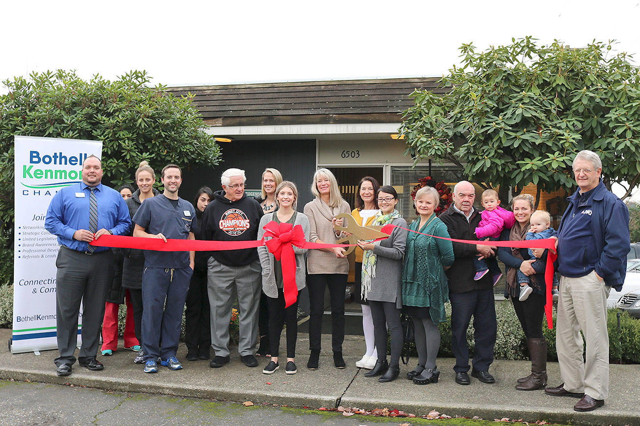 The Bothell-Kenmore Chamber of Commerce, community members and staff members gathered to celebrate the ribbon cutting ceremony for Dr. Eugenia Lee, outside Kenmore Dental Care on Tuesday, Nov. 13. Stephanie Quiroz/staff photo.