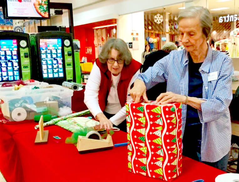 Volunteers from the North Bellevue Community Center offer grift wrapping Dec. 15 to 24, with proceeds going to their programs