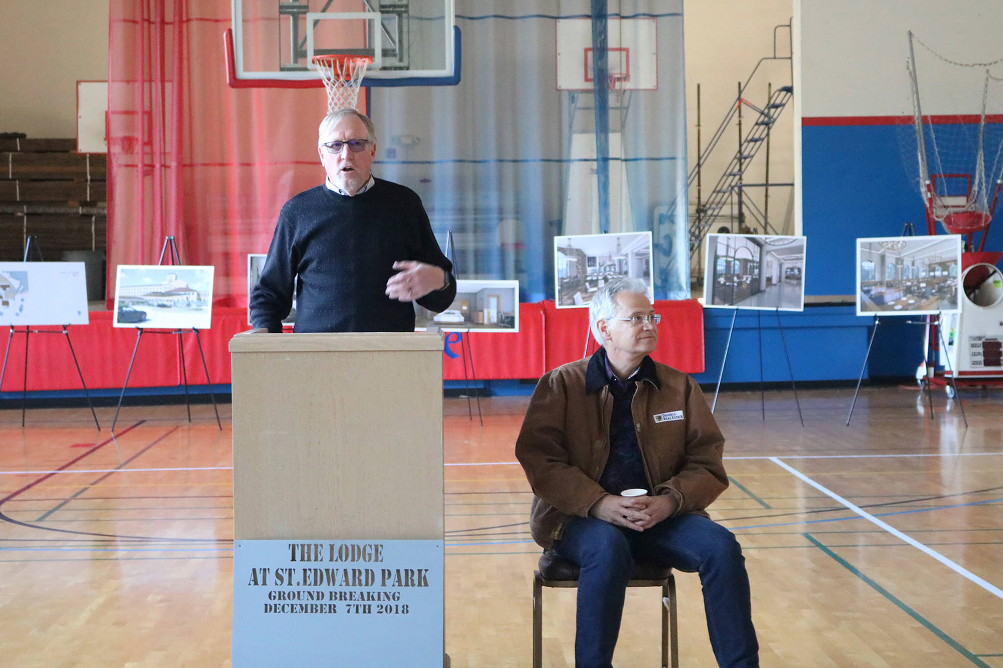 Ken Bounds and Kevin Daniels thank supporters of the Lodge at Saint Edward Park project on Dec. 7 in the gym next door to the seminary building. Katie Metzger/staff photo