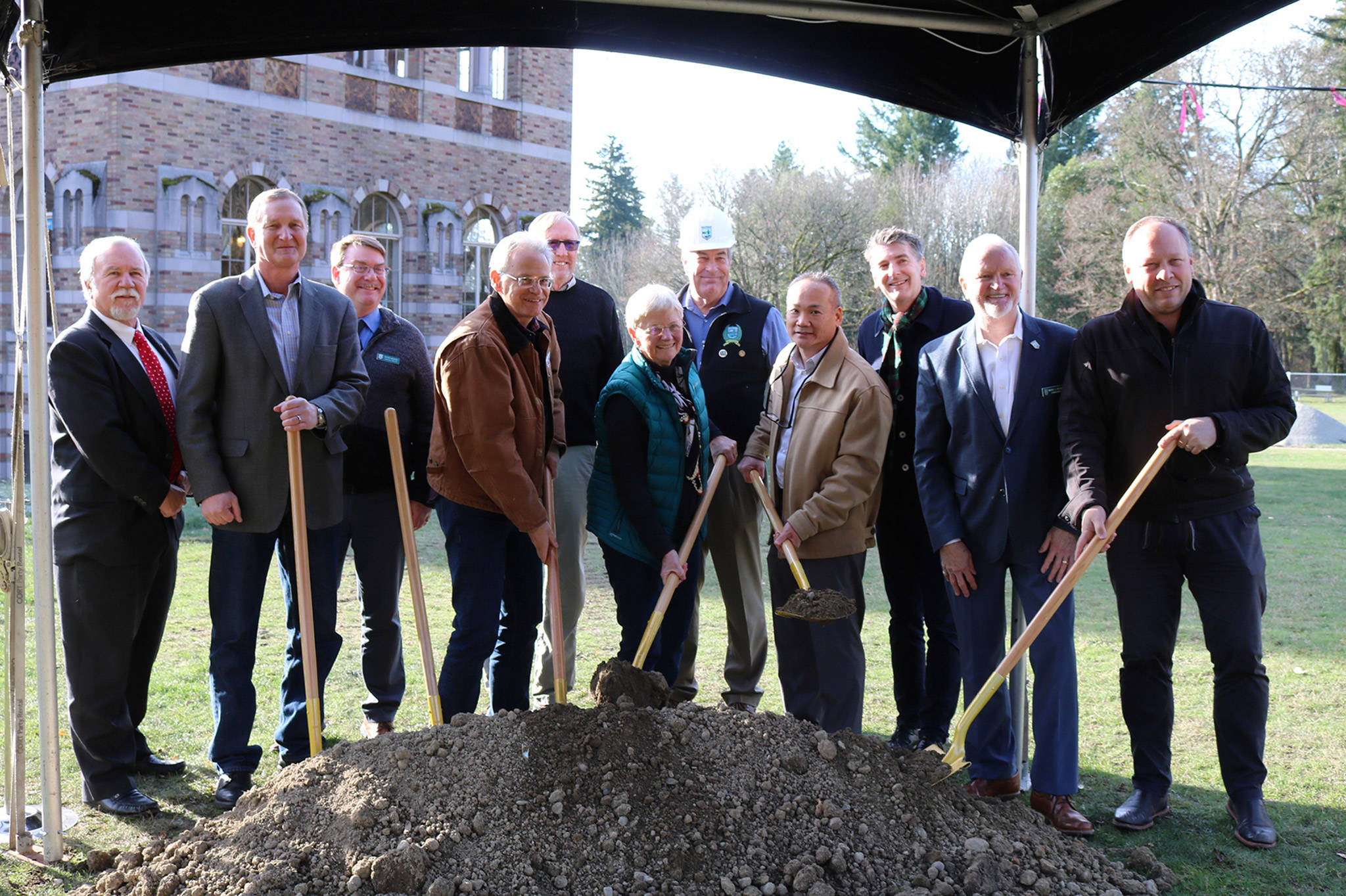 State legislators Jeff Holy and David Frockt pose with Kevin Daniels and Washington State Parks commissioners and staff at the ceremonial groundbreaking for the Lodge at Saint Edward Park on Dec. 7. Katie Metzger/staff photo