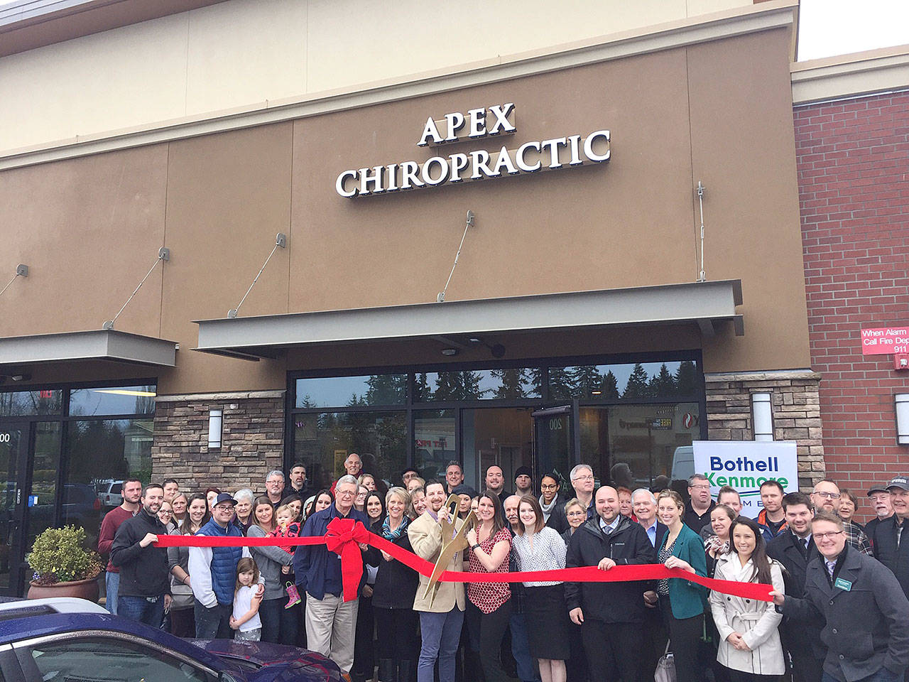 The Bothell-Kenmore Chamber of Commerce, along with the community gathered to celebrate the ribbon cutting ceremony for Apex Chiropractic on Jan 10. Photo courtesy of Apex Chiropractic