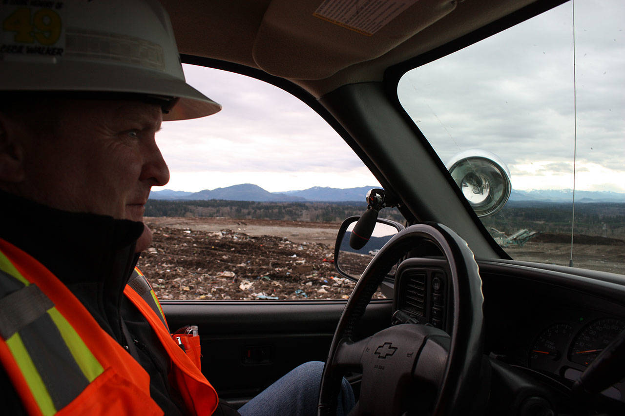 Barden, assistant operations manager for the King County Solid Waste Division, sits in his truck atop the landfill on Jan. 18. Aaron Kunkler/staff photo