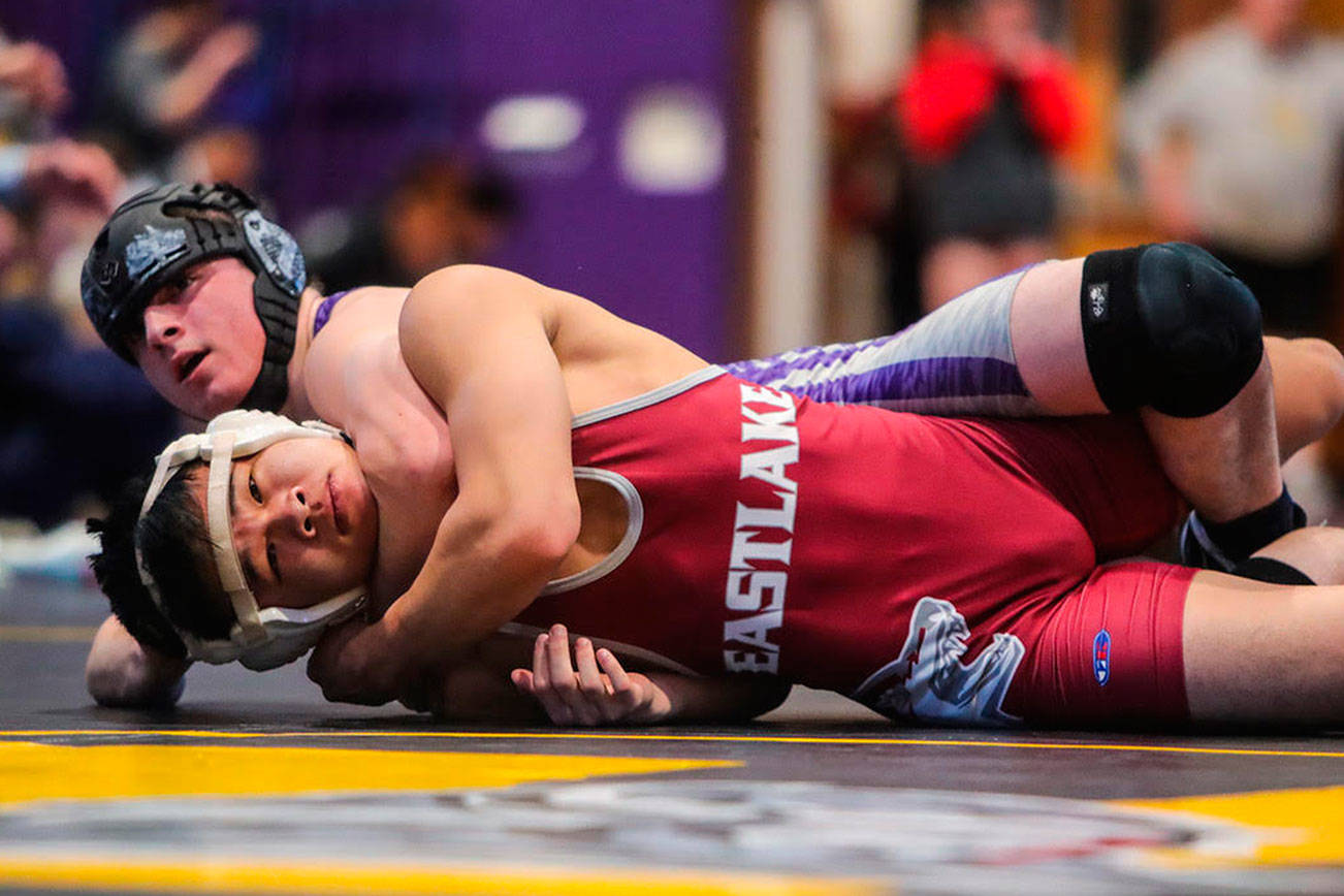 North Creek Jaguars 138-pound grappler Hunter Tretyak defeated Eastlake’s Chris Hom 11-0 in 4A KingCo 138-pound championship match on Feb. 2 at North Creek High School. Photo courtesy of Don Borin/Stop Action Photography