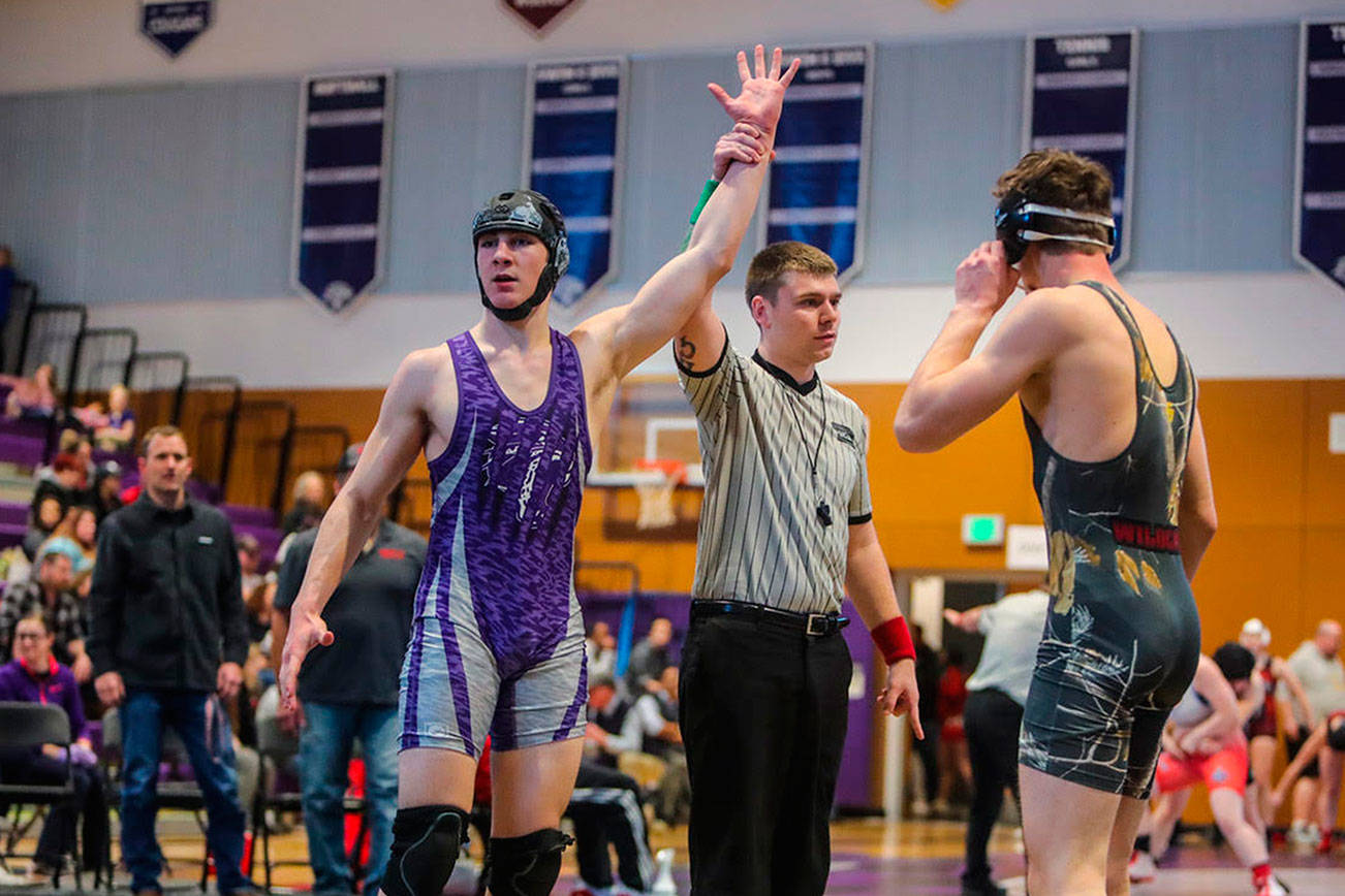 North Creek Jaguars wrestler Matt Kendrick pinned Mount Si’s Sage Phelps in a mere 33 seconds in the 4A KingCo 170-pound championship match on Feb. 2 at North Creek High School. Photo courtesy of Don Borin/Stop Action Photography