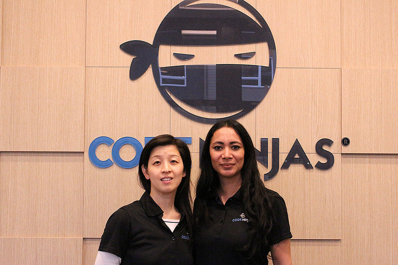 From left, Clara Ling (franchise owner) and Daisy Quitugua (center director) at the soft opening of Code Ninjas on Feb. 1. Madison Miller/staff photo