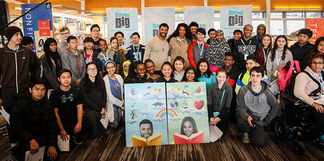 Russell Wilson and Ciara pose with the students from Foster High School at the conclusion of Friday’s event. Courtesy photo by Why Not You Foundation