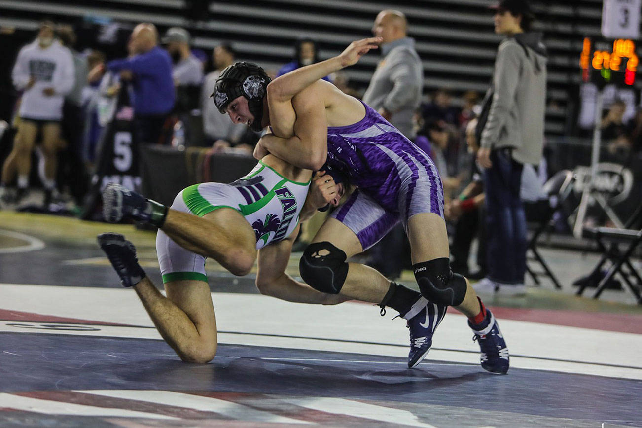North Creek Jaguars senior 170-pound wrestler Matt Kendrick, right, pinned Woodinville’s Nolan Downs, left, in the first round of the Mat Classic Class 4A state tournament on Feb. 15 at the Tacoma Dome. Photo courtesy of Don Borin/Stop Action Photography