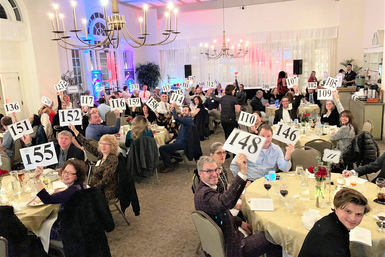 Photo courtesy of the Bothell Kenmore Chamber of Commerce                                 Attendees at the Bothell Kenmore Chamber of Commerce annual auction donated nearly $8,000 towards Mary’s Place cell phone campaign.
