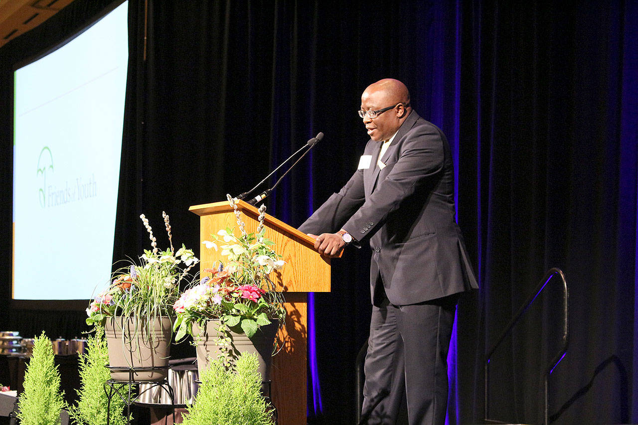 New Friends of Youth CEO, Paul Lwali, speaks at the Celebration of Youth luncheon on March 1. Madison Miller/staff photo.