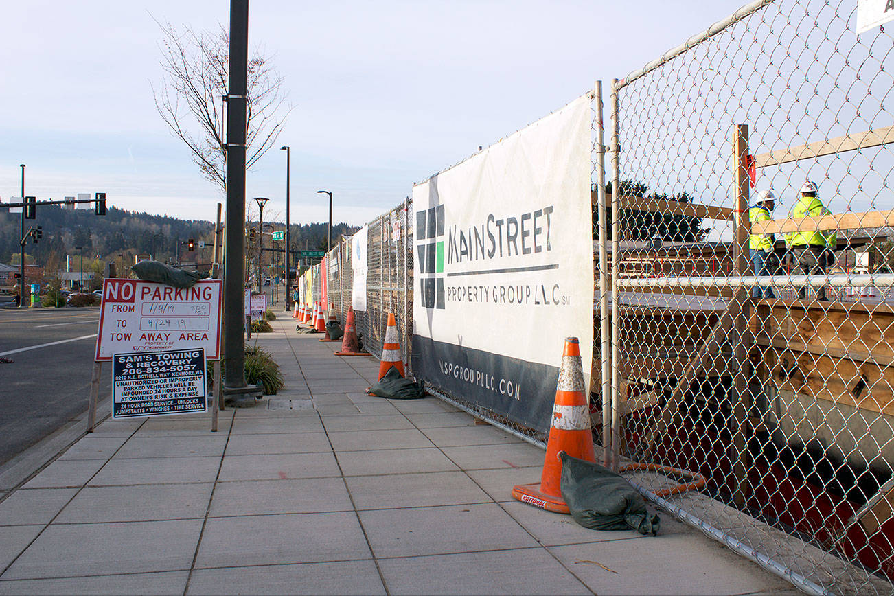 Work crews construct the first floor of Kenmore’s newest downtown development, the Flyway. The building is adjacent to the Hangar, Kenmore’s community center, and will be a mixed retail and residential space.