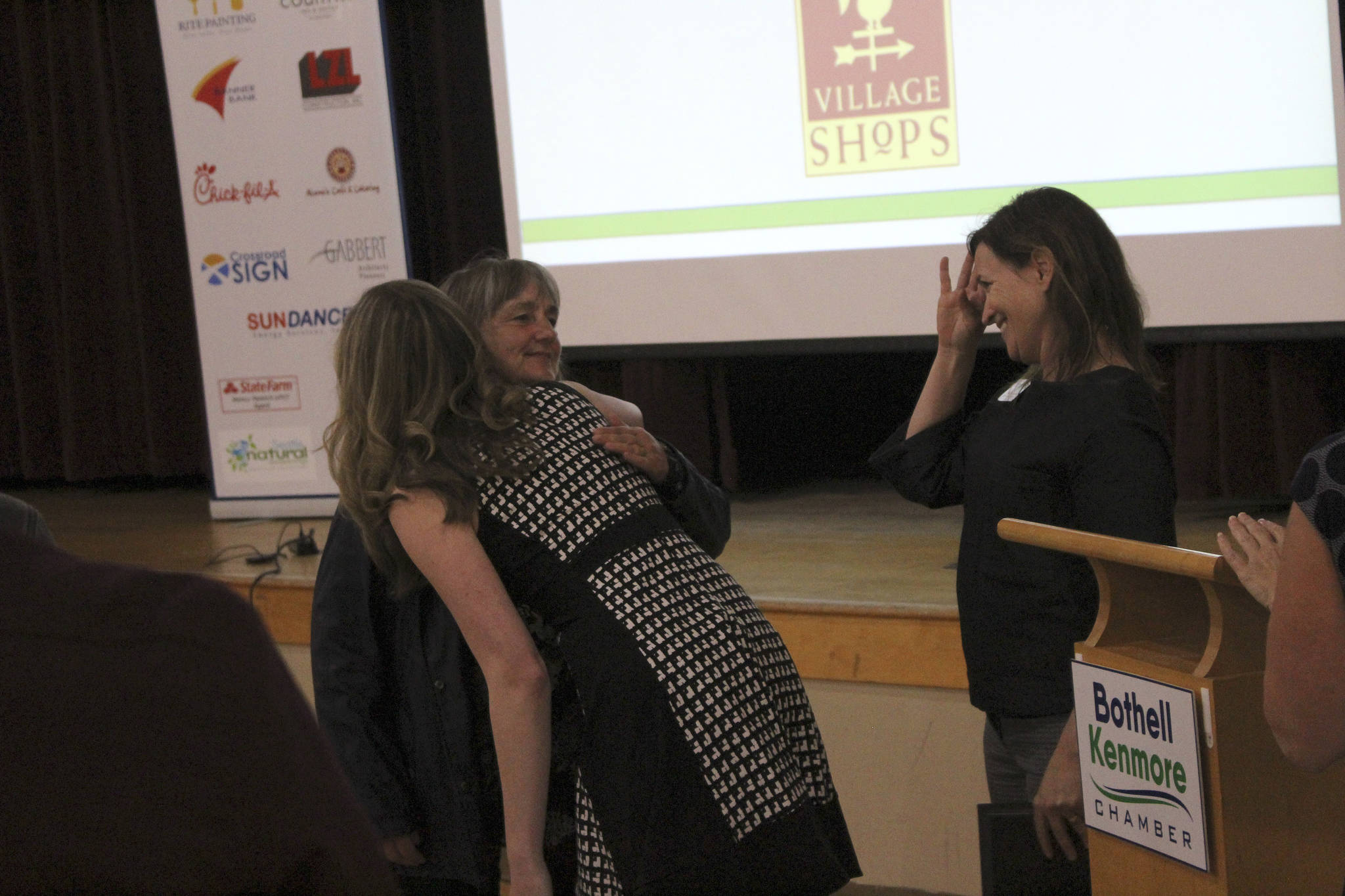 Maurita Colburn, the chamber’s Member and Community Relations manager, welcomes Country Village owner Leeann Tesorieri as she receives a standing ovation from local business owners. Kailan Manandic/staff photo