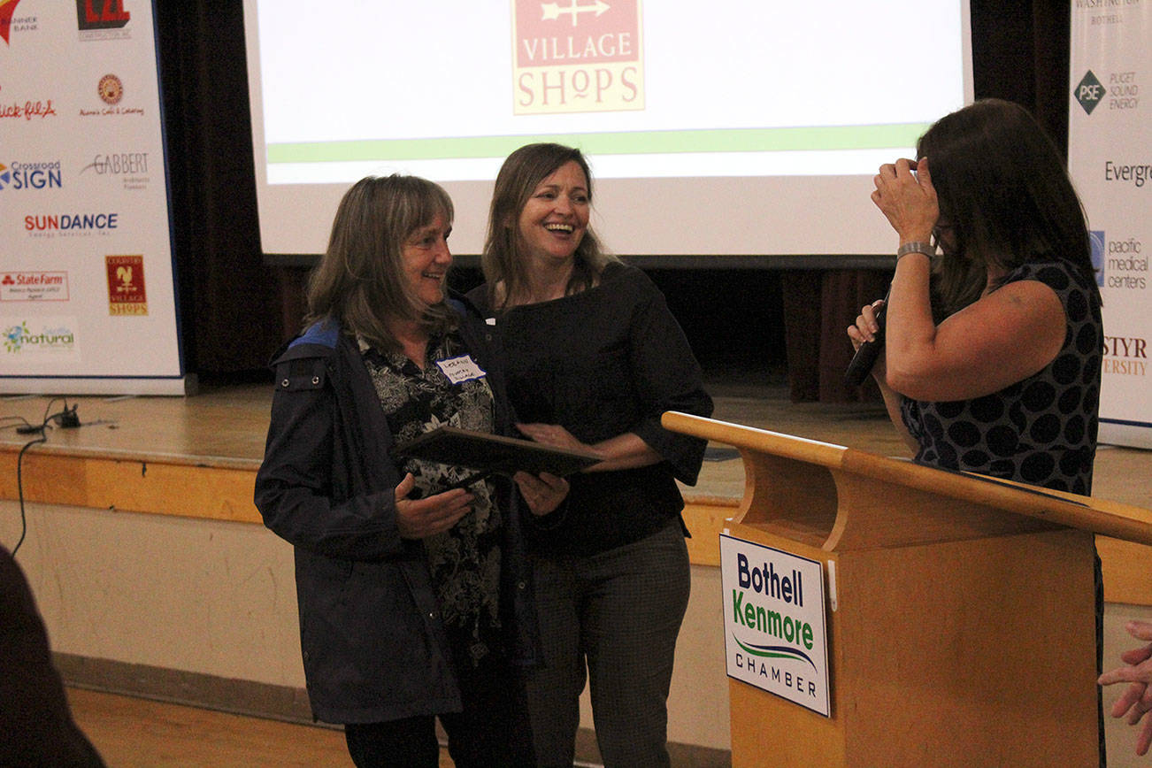 Maurita Colburn, the chamber’s Member and Community Relations manager, welcomes Country Village owner Leeann Tesorieri as she receives a standing ovation from local business owners. Kailan Manandic/staff photo