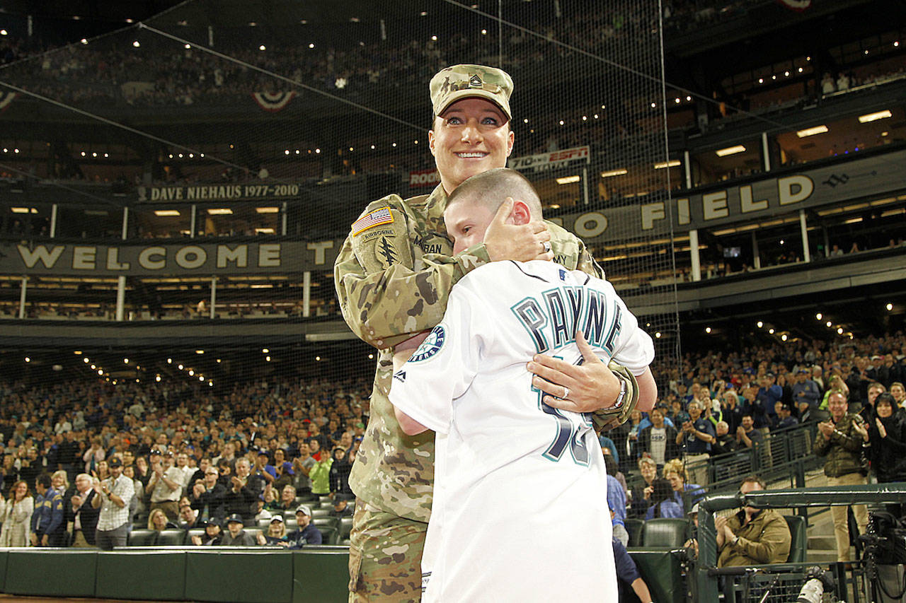 Photo courtesy of Payne’s family                                Photo from a Mariner’s game where Heather Moran surprised Ryan after coming home from a deployment.
