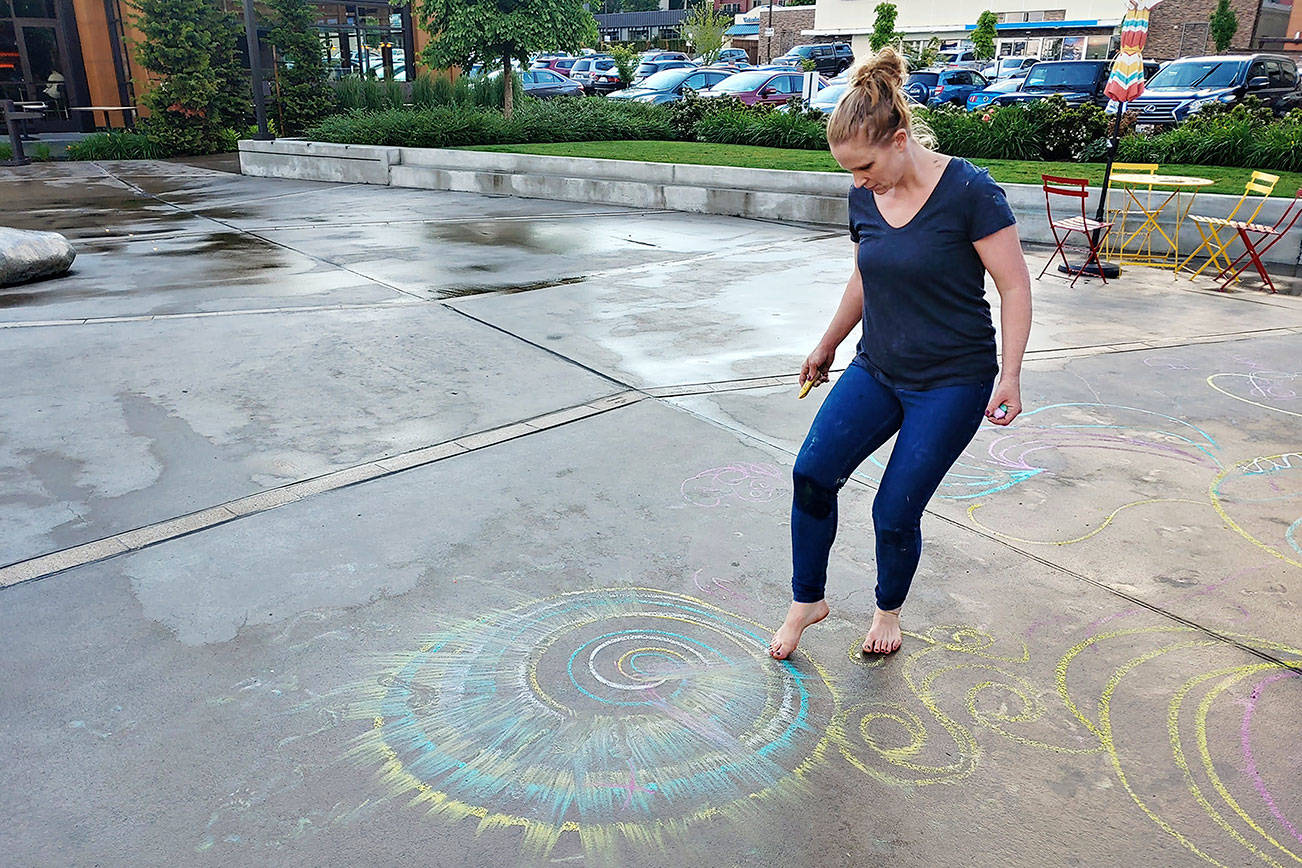 Just Get Me Started founder Suzanne Tseng participates in one of the weekly workshops that taught locals how to create intricate chalk art.