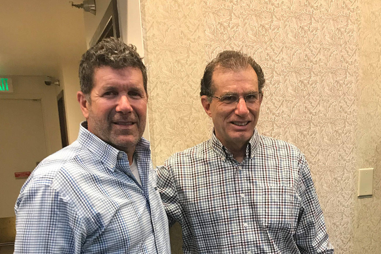 Seattle Mariners legend Edgar Martinez, left, and Seattle Times columnist Larry Stone, right, collaborated on a book titled, “Edgar: An Autobiography.” Martinez and Stone attended a book signing on June 12 at Barnes Noble in Bellevue. Shaun Scott/staff photo