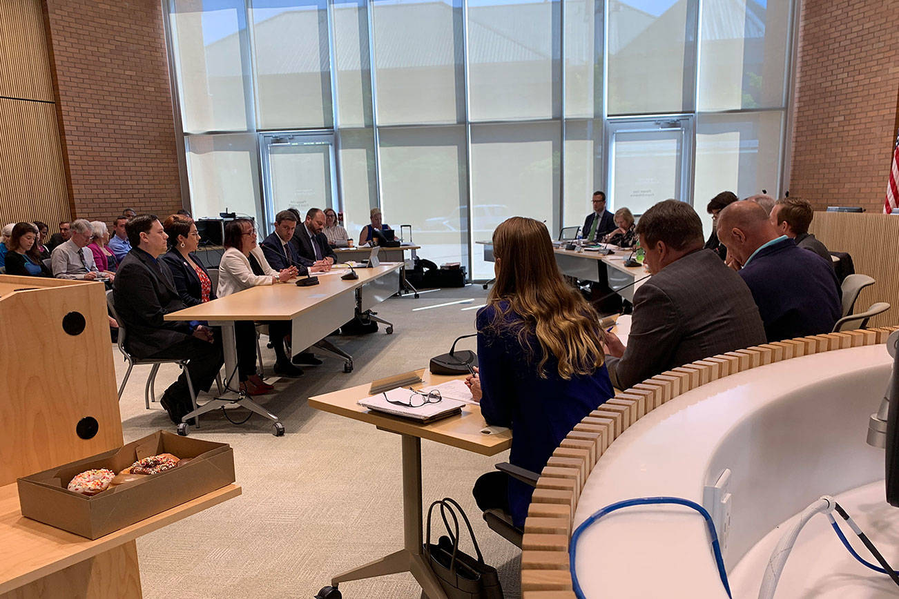 King and Snohomish County councils listen to brief statements from the three candidates running for the vacant Senate seat. Madeline Coats/staff photo