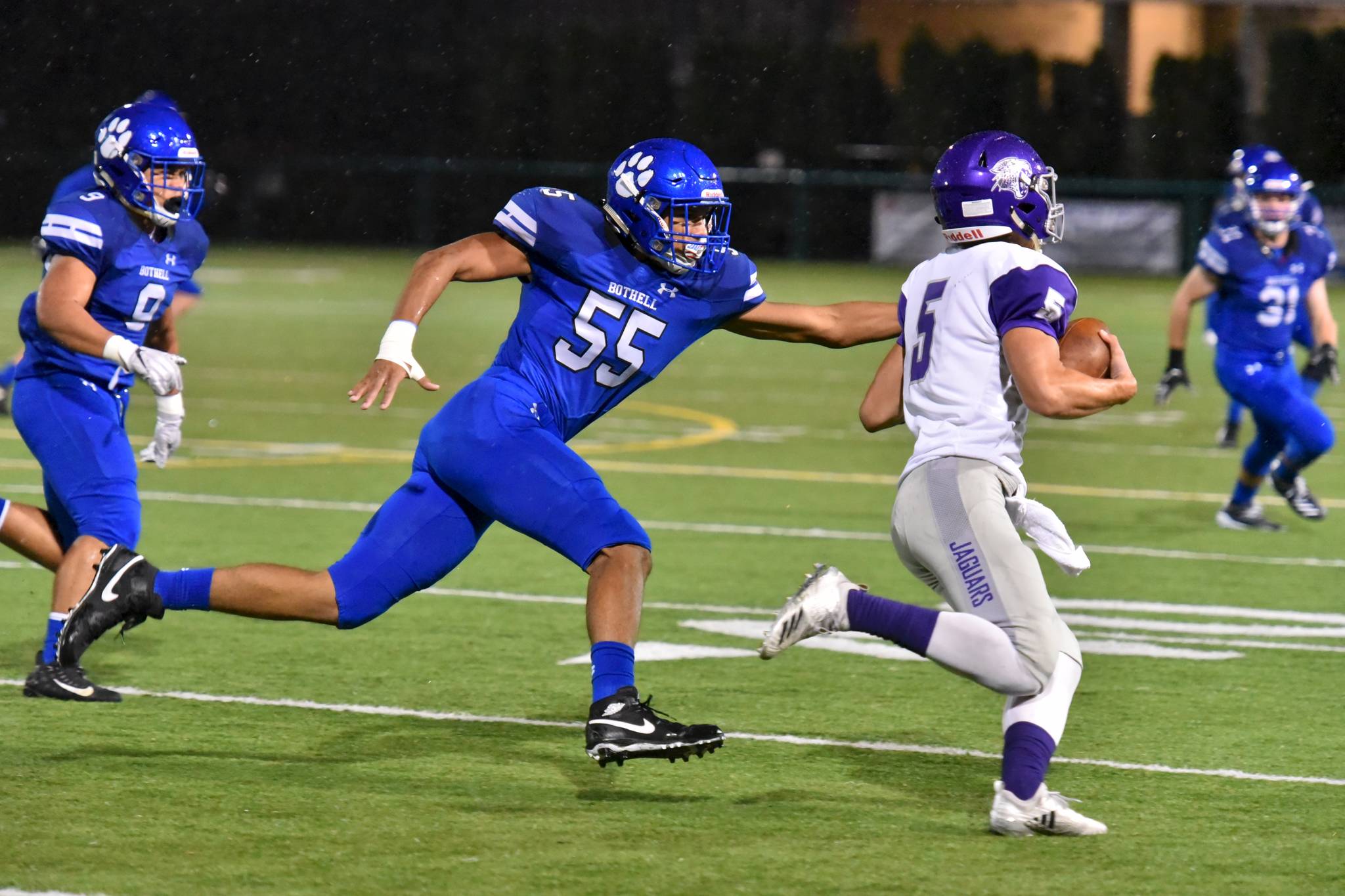Bothell’s Gabriel Johnson reaches for North Creek’s Jack Charlton on Sept. 27. Photo courtesy of Greg Nelson