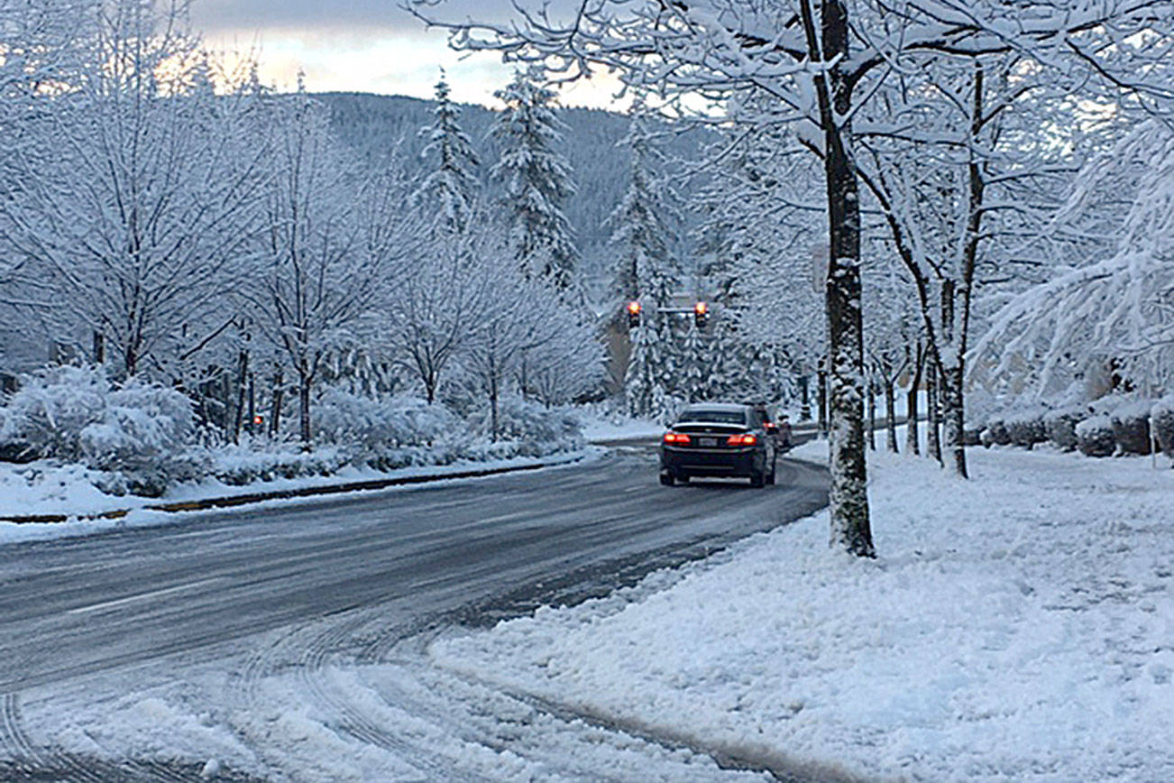 Several roads in King County, including the Snoqualmie Parkway, were closed when a brief snow storm struck the region last February. File photo