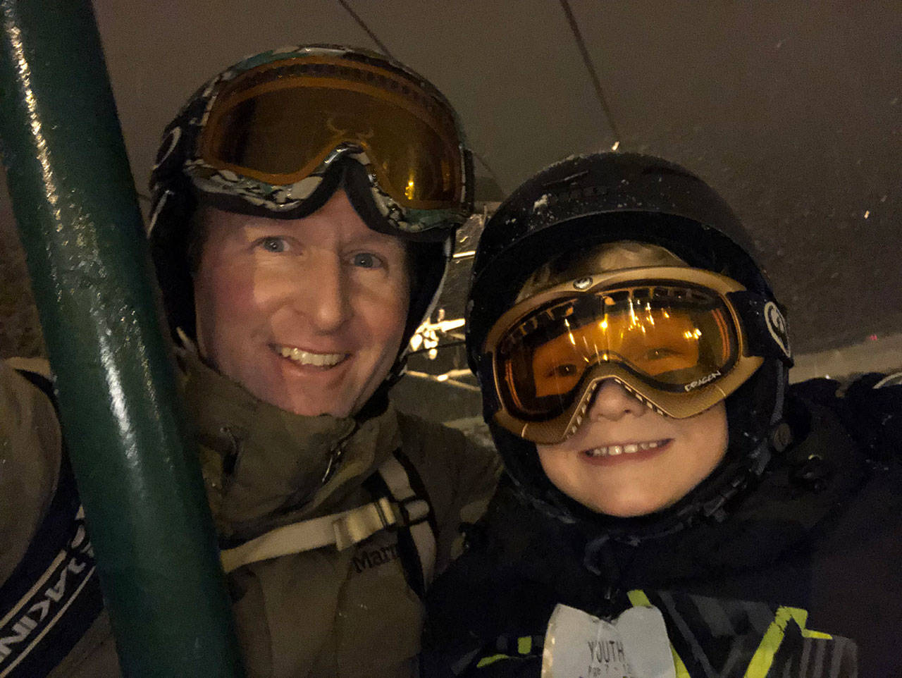 Photo courtesy Gary Robinson                                 Kirk Robinson and his oldest son, Gavin, on a ski trip.