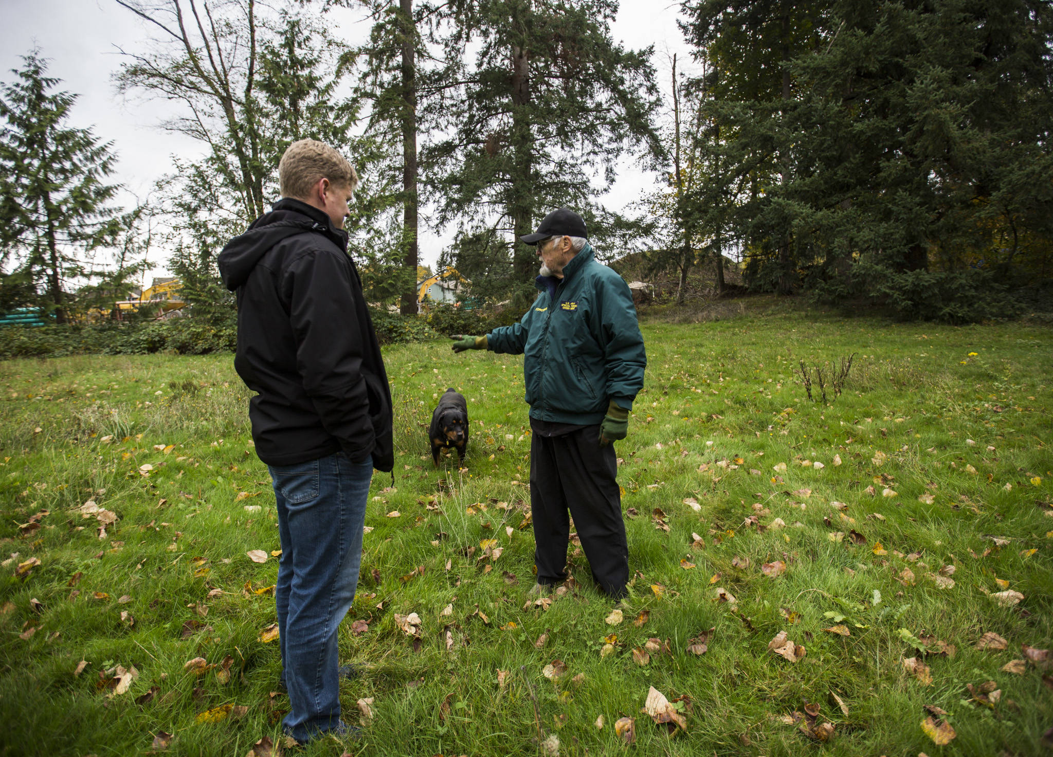Jim Corcoran (right) talks to Ken Klein from the Snohomish County Executive’s Office about a small baseball field on his land in Bothell. Olivia Vanni/staff photo