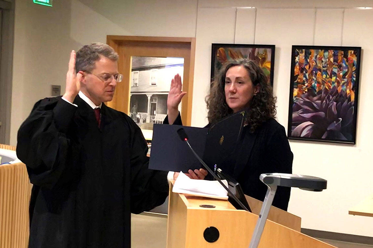 Judge Mara Rozzano was ceremonially sworn in by superior court judge George Appel during the Bothell City Council meeting on Dec. 3. Photo courtesy of city of Bothell