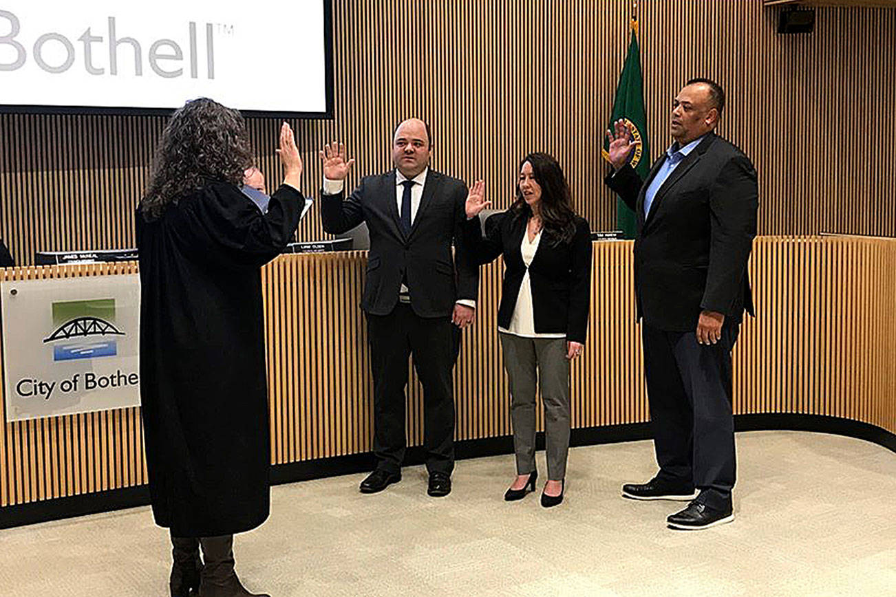 Mason Thompson, Davina Duerr and James McNeal being sworn in at the Jan. 7 Bothell City Council meeting. Photo courtesy city of Bothell